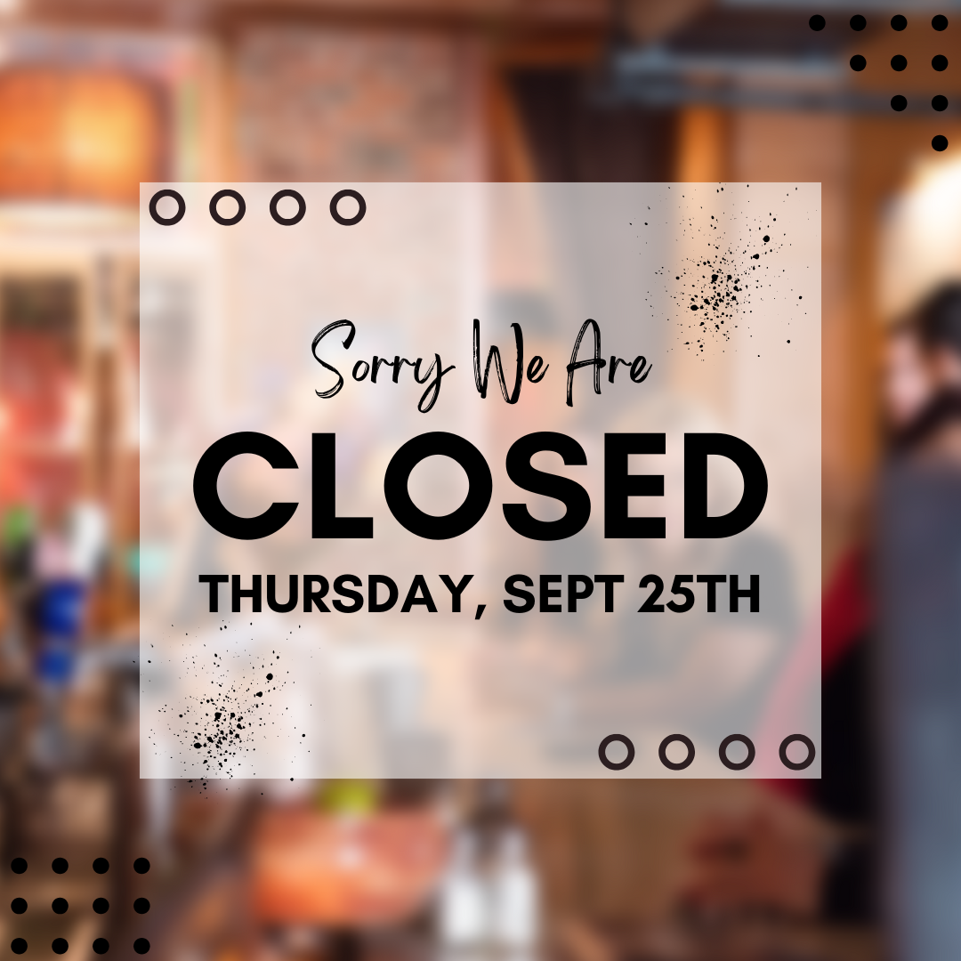 A brown rectangular sign with black text says, 